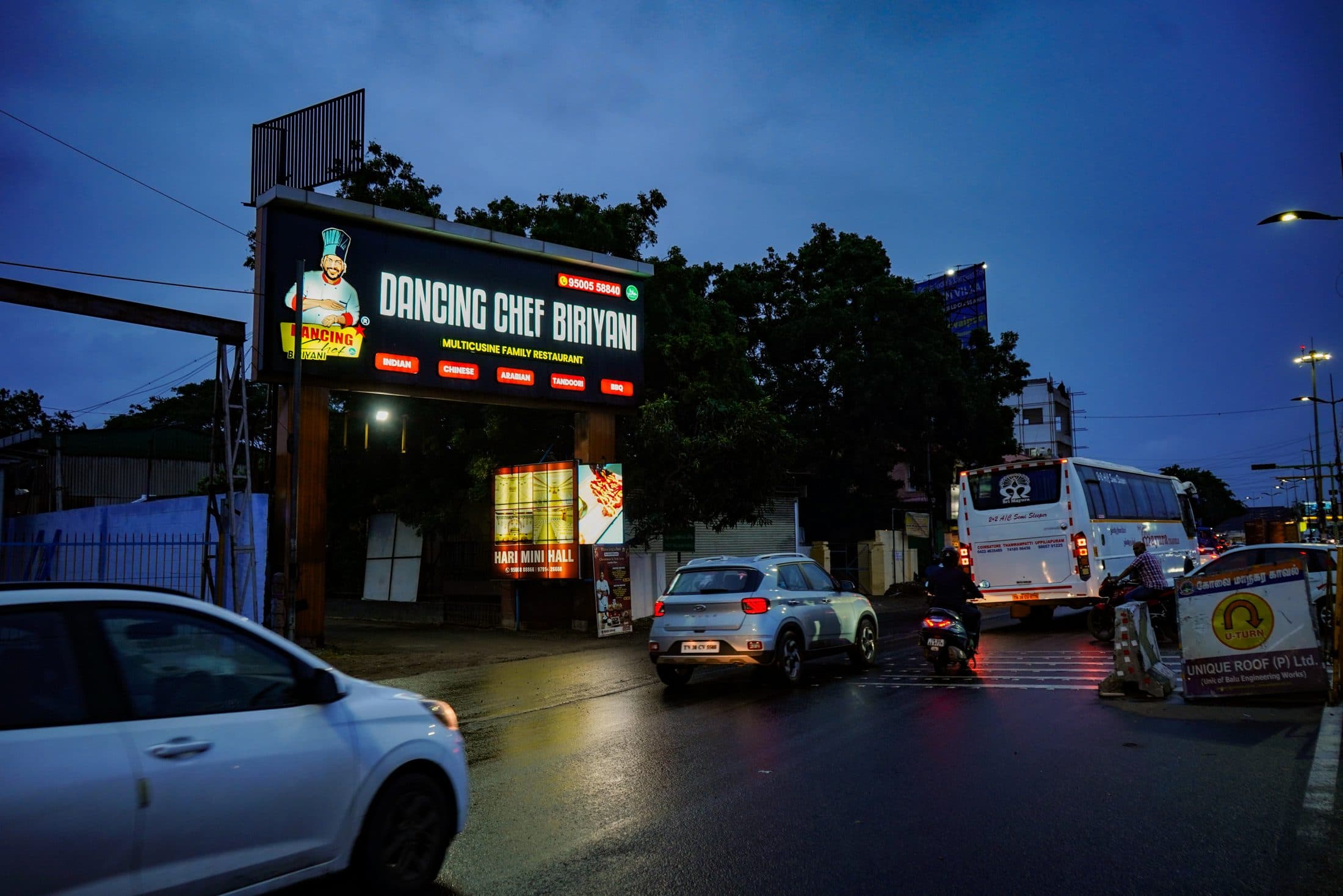 Dancing Chef Biriyani lit up after dark in Coimbatore